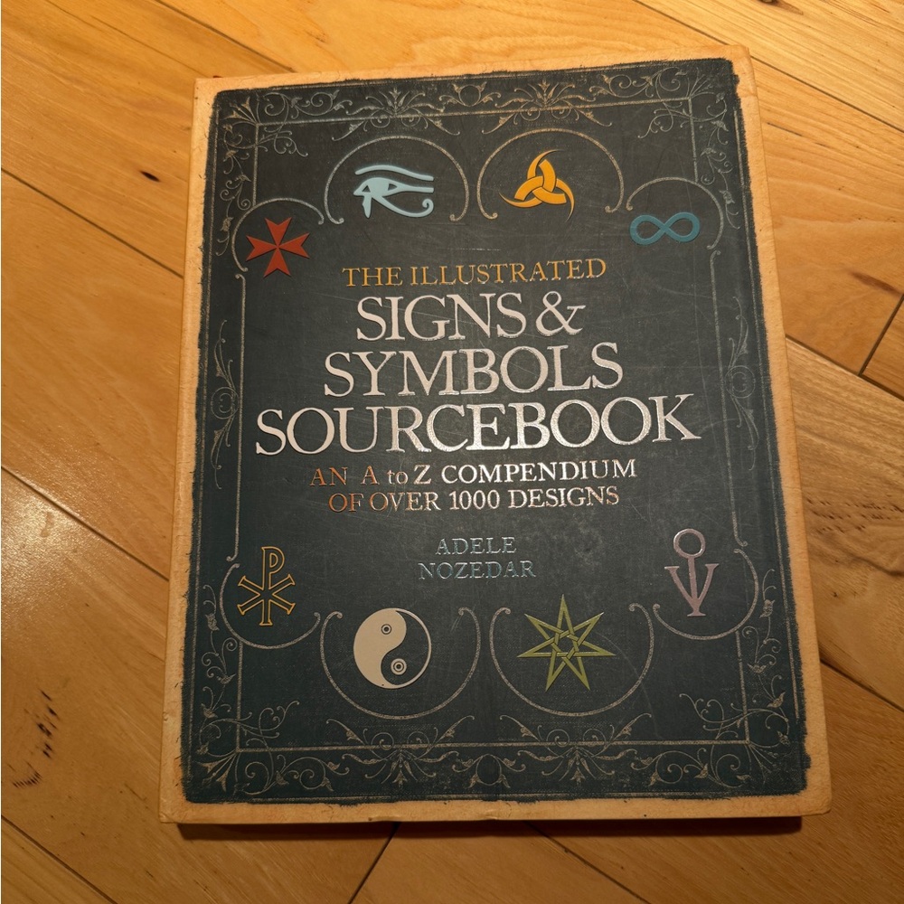 The Illustrated Signs & Symbols Sourcebook by Adele Nozedar